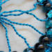extreme detailed wire branches strung crackle glass beads, wire branches, and a yarn-wrapped hoop. Handmade by Beneath the Oak Designs.